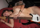Playing the guitar with her nice twat