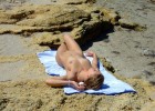 Sexy blonde suntanning totally nude