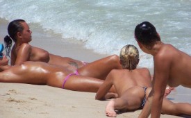 880-Topless-babes-resting-on-the-seashore.jpg
