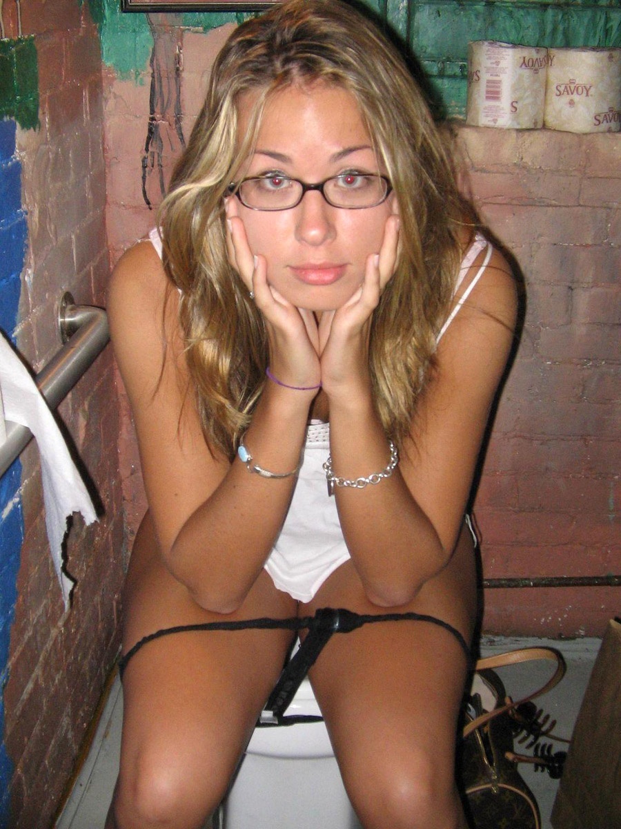 Amateur blond posing with glasses on