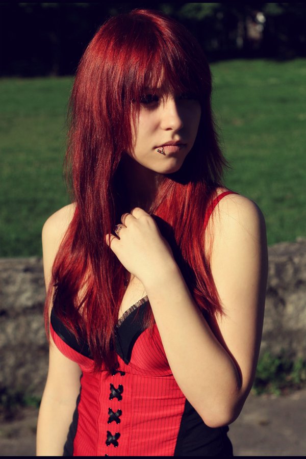 Cute redhead with lip piercing posing sexy