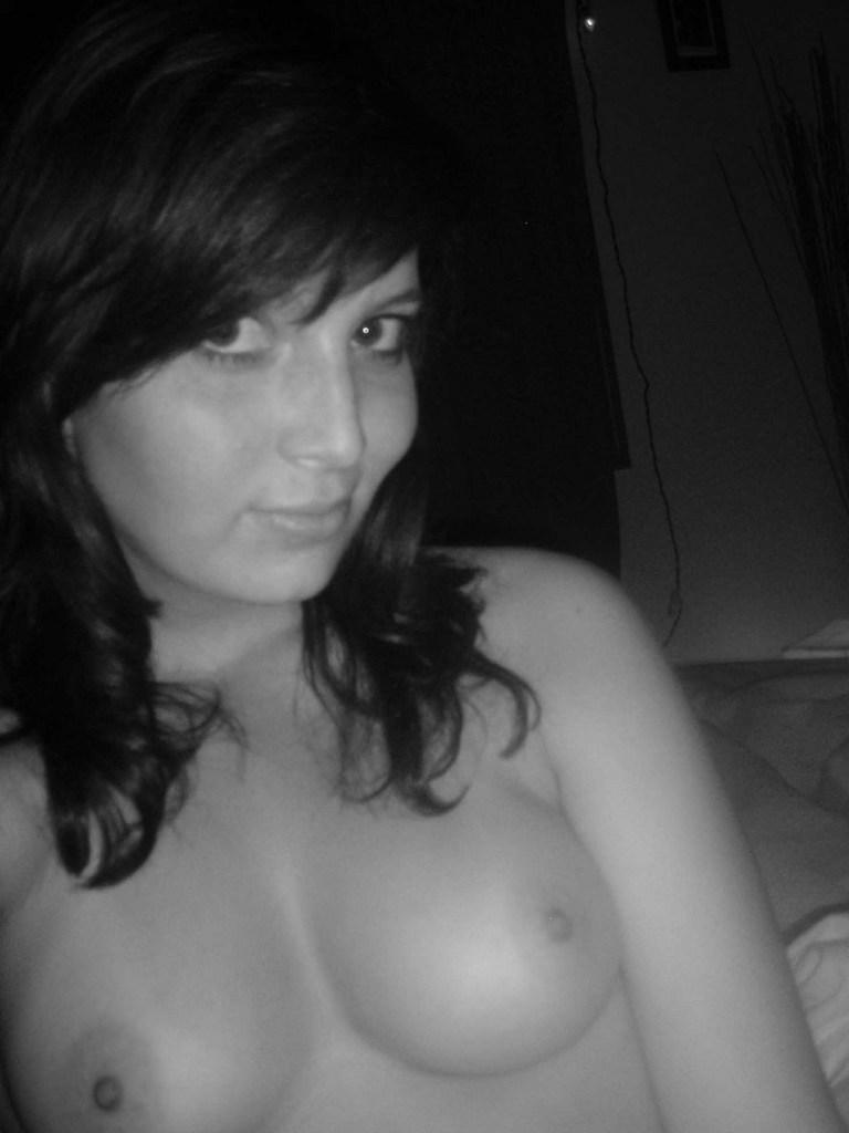 Brunette showing her tits for the camera