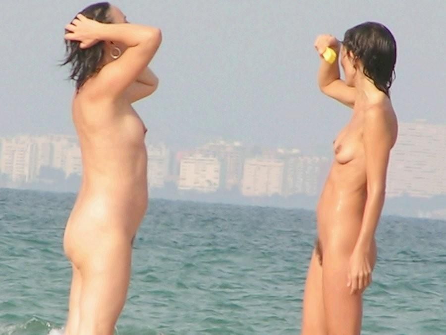 Nude teens enjoying the warmth of the sun